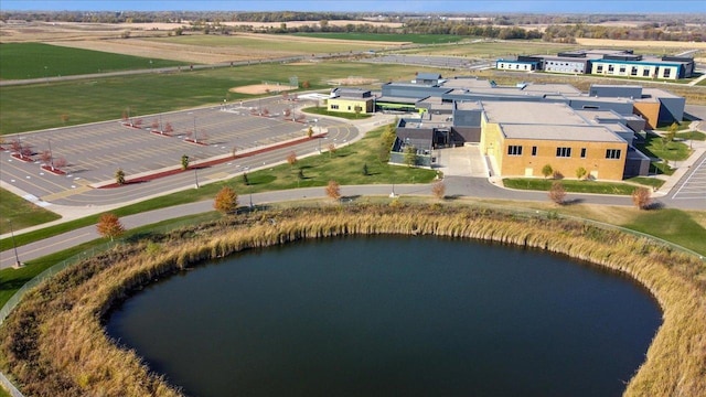 birds eye view of property featuring a water view and a rural view