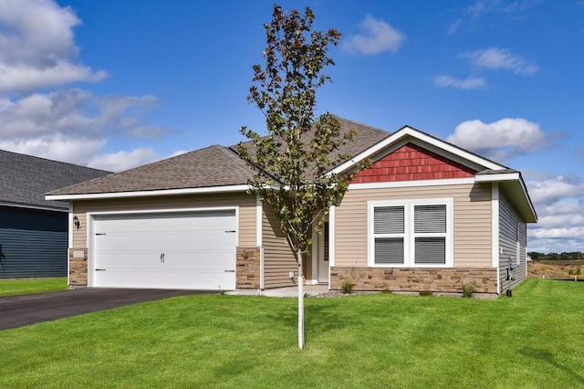 craftsman house with stone siding, a front yard, aphalt driveway, and an attached garage