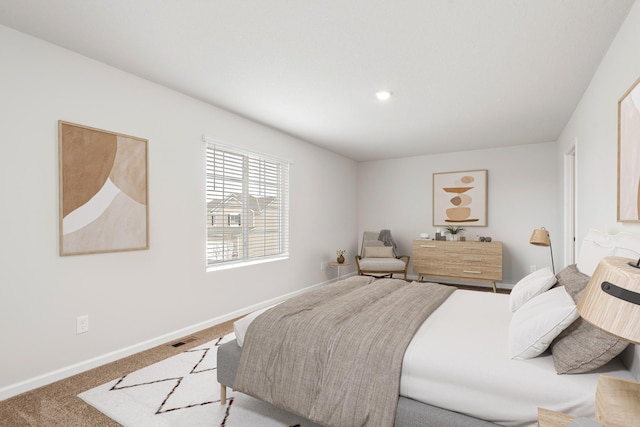 bedroom with carpet flooring, baseboards, and visible vents