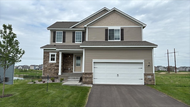 18721 Grant St NW, Elk River, MN 55330 - craftsman-style home with stone siding, an attached garage, and a front lawn