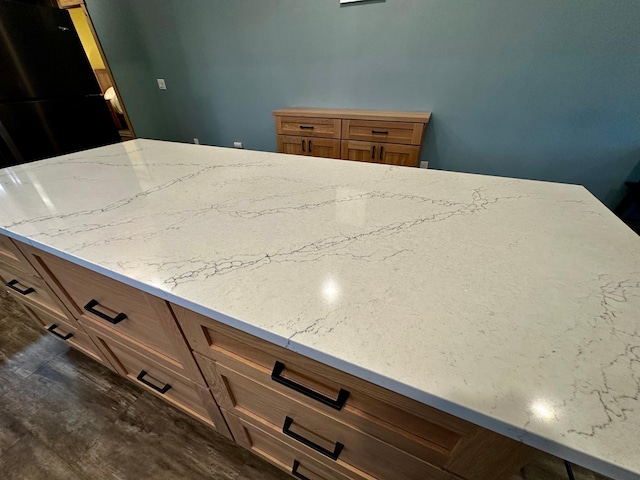 kitchen featuring light stone counters