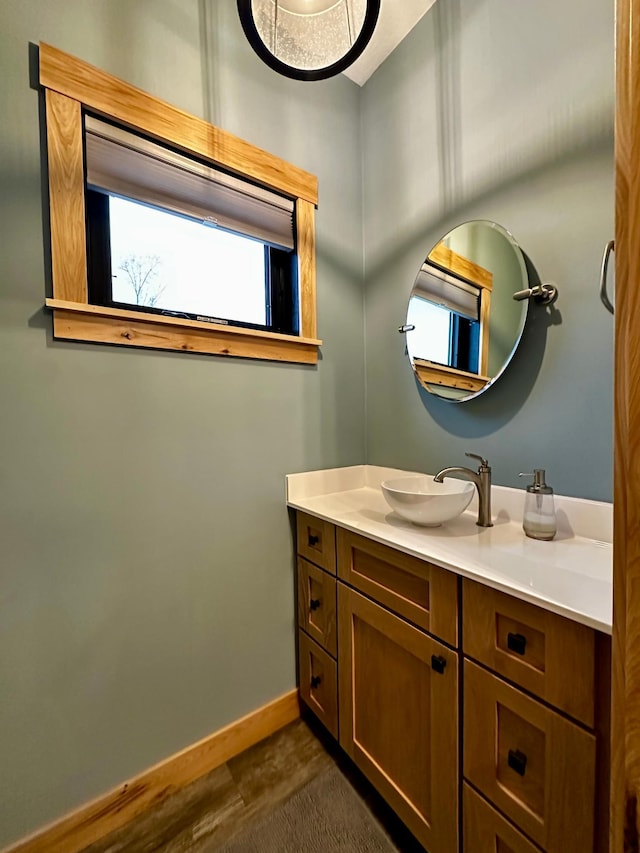 bathroom featuring hardwood / wood-style flooring and vanity