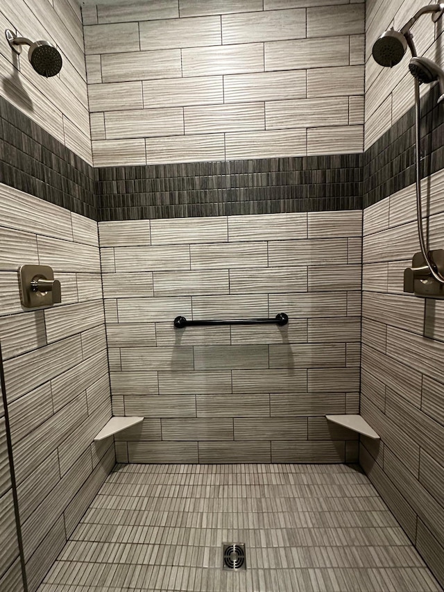 bathroom with tiled shower