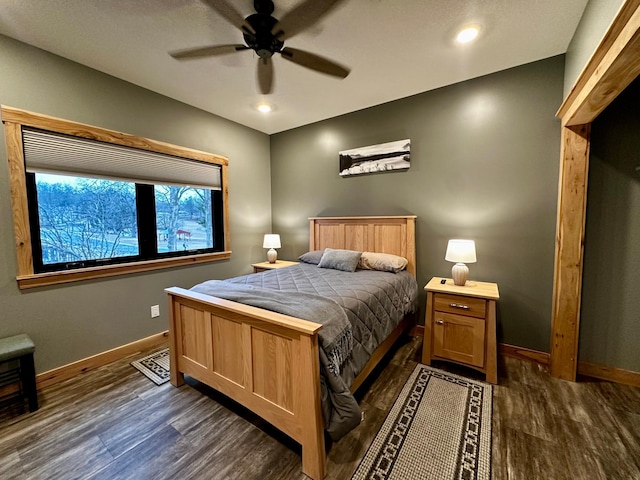 bedroom featuring dark wood-type flooring and ceiling fan