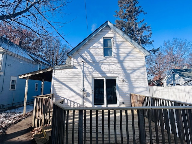 rear view of house featuring a deck