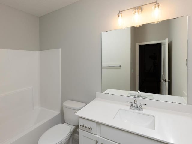 full bathroom featuring vanity, toilet, and  shower combination