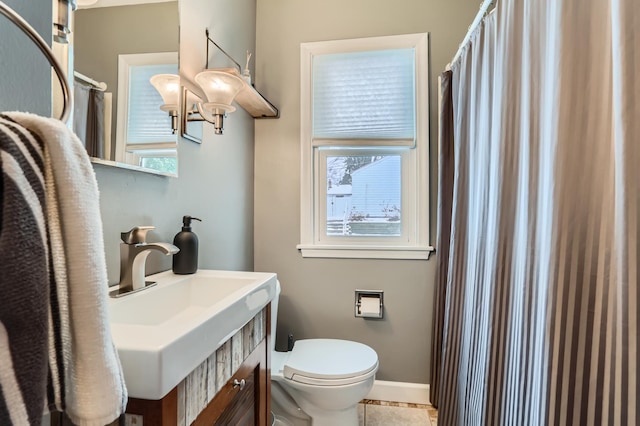 bathroom with sink, tile patterned floors, and toilet