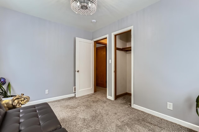 unfurnished room featuring carpet