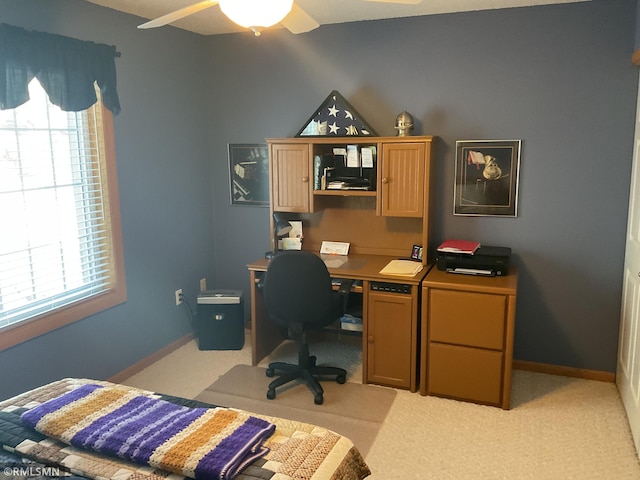 office area featuring light colored carpet and ceiling fan