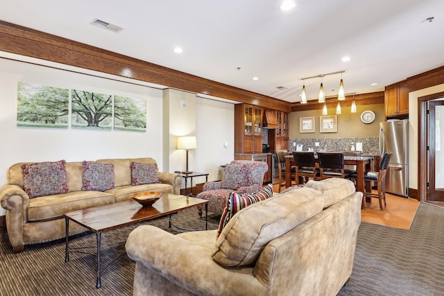 living room with visible vents and recessed lighting