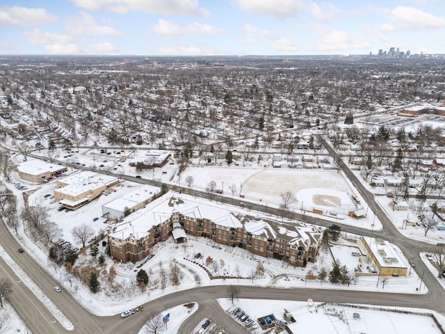 snowy aerial view featuring a view of city