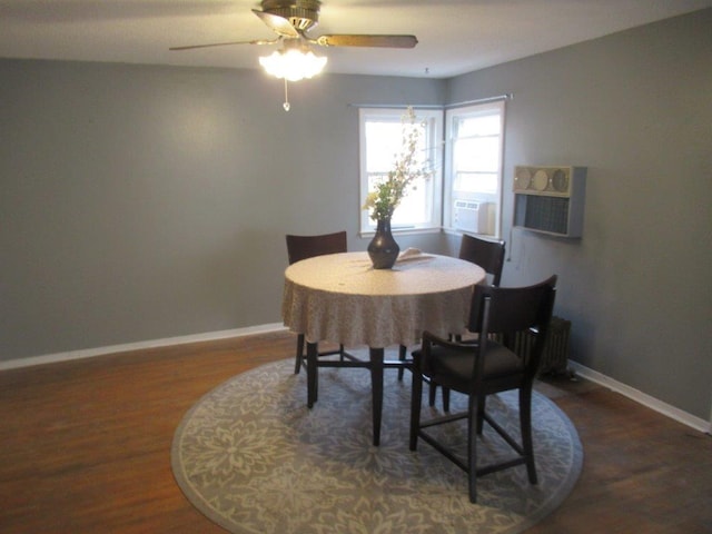 dining room with ceiling fan, cooling unit, and dark wood-type flooring