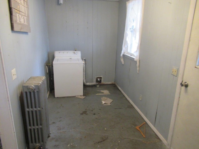 clothes washing area with radiator and washer / clothes dryer