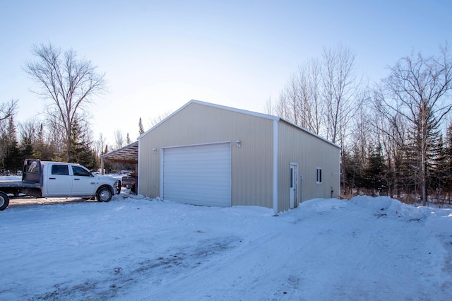 view of snow covered garage