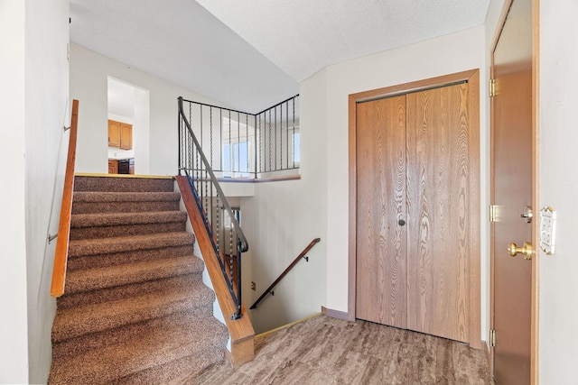 interior space with hardwood / wood-style floors and a textured ceiling