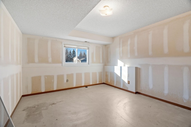 empty room featuring a textured ceiling