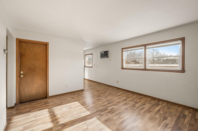 unfurnished room with light wood-type flooring