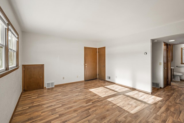 empty room featuring hardwood / wood-style flooring