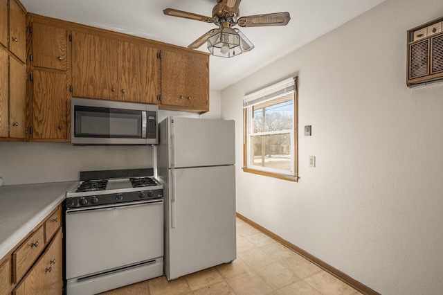 kitchen with ceiling fan and white appliances