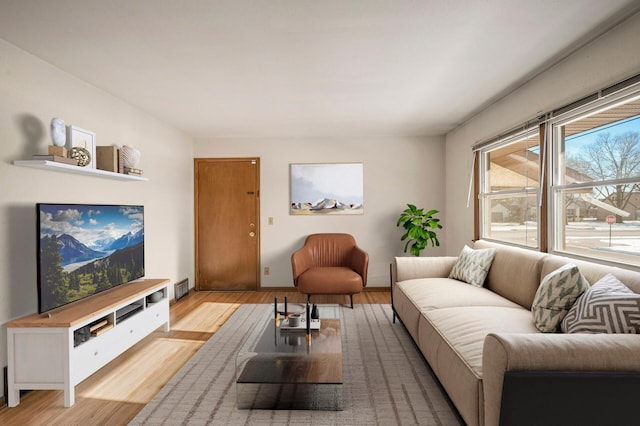 living room with light hardwood / wood-style floors