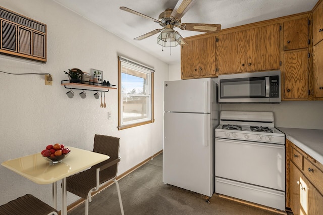 kitchen featuring ceiling fan, white appliances, and a wall mounted AC