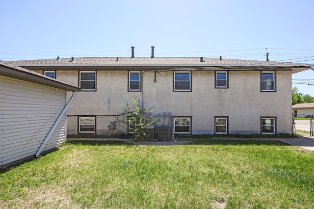 rear view of property with stucco siding