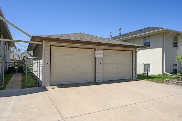 detached garage featuring a gate