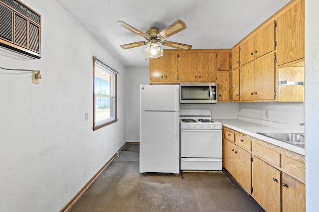 kitchen with white appliances, baseboards, finished concrete flooring, a sink, and a ceiling fan
