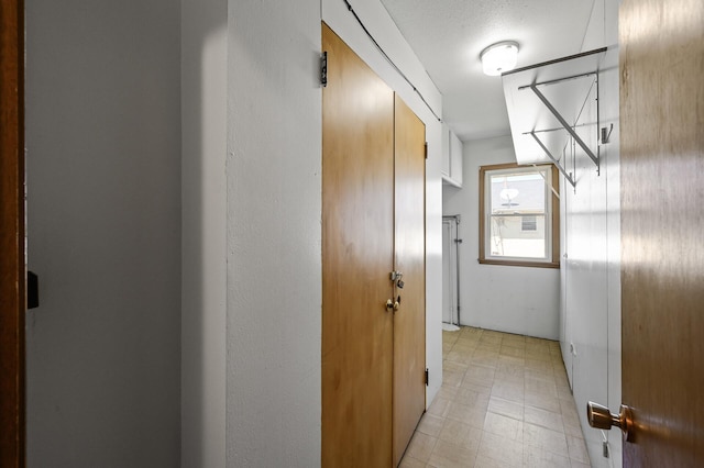 corridor featuring light floors