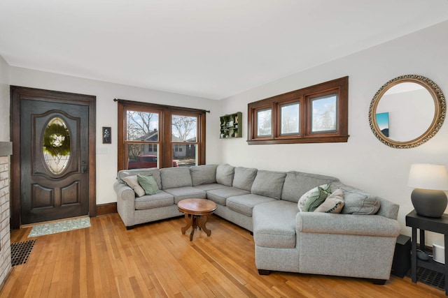 living room with light hardwood / wood-style floors