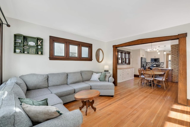 living room with a healthy amount of sunlight and wood-type flooring