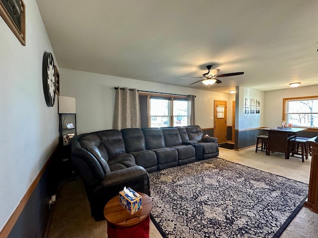 carpeted living room featuring a healthy amount of sunlight and ceiling fan