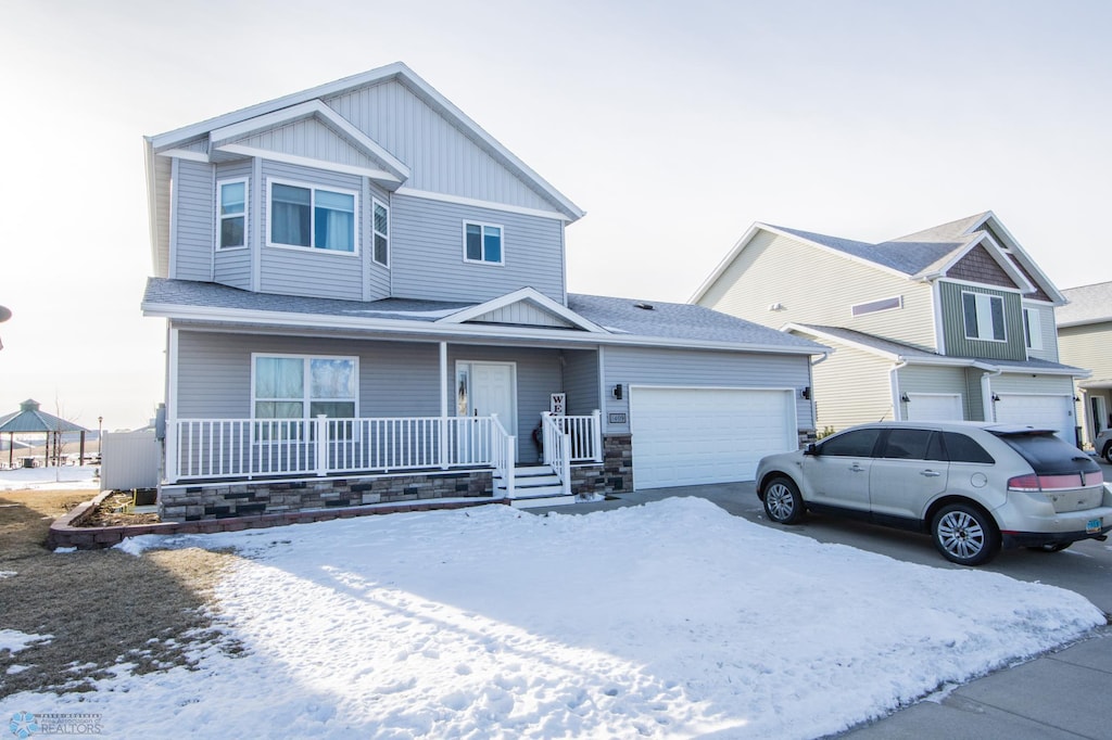 view of front of home with a garage and covered porch