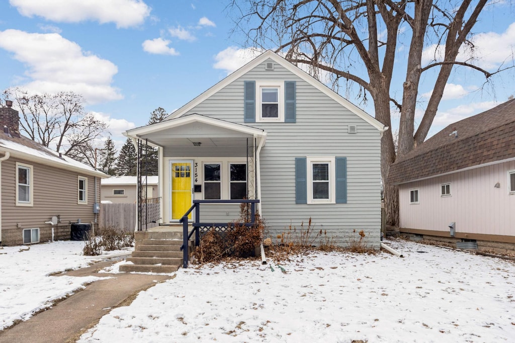 bungalow-style home featuring cooling unit