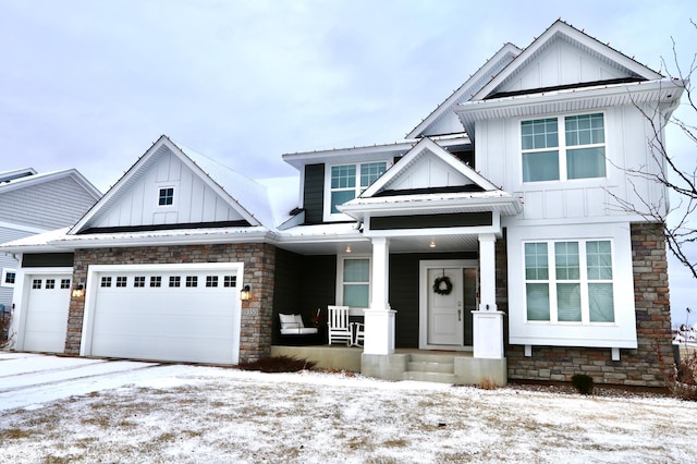 view of front of home with a porch and a garage