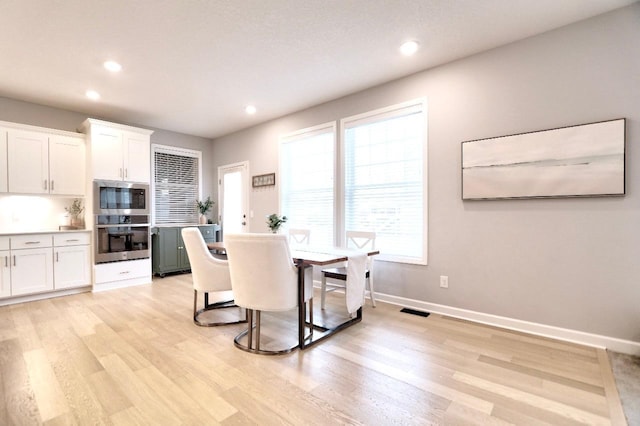 dining room featuring light hardwood / wood-style floors