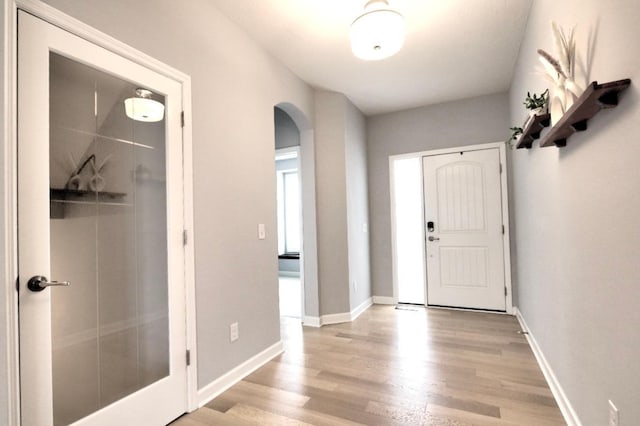 foyer entrance with light hardwood / wood-style floors