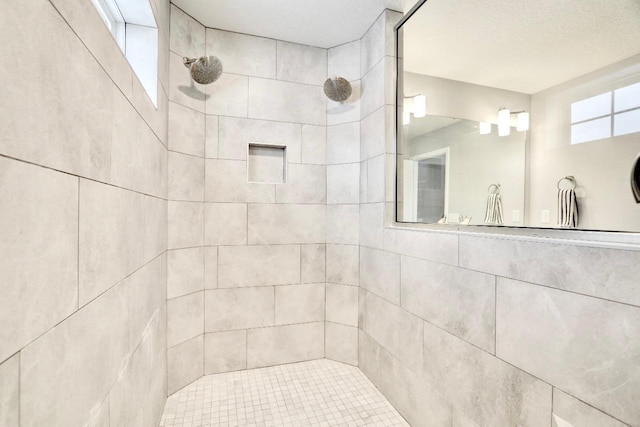 bathroom featuring a tile shower