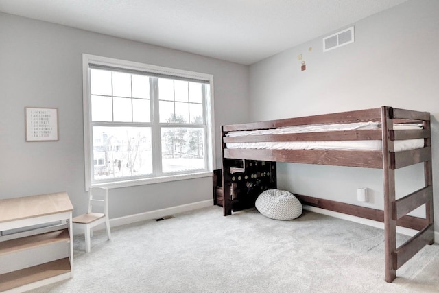 bedroom featuring light colored carpet