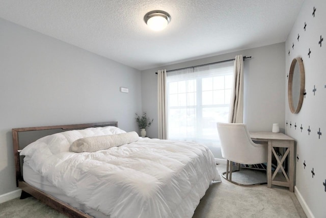 carpeted bedroom with a textured ceiling