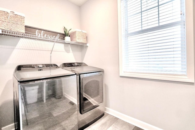 laundry room with independent washer and dryer