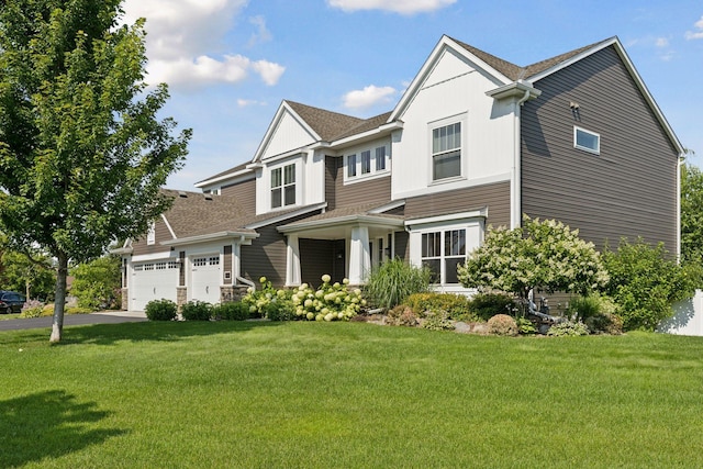 view of front facade featuring a garage and a front lawn