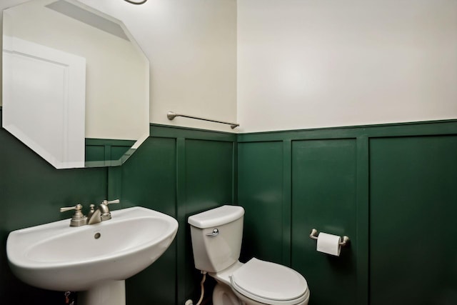 bathroom with sink and toilet