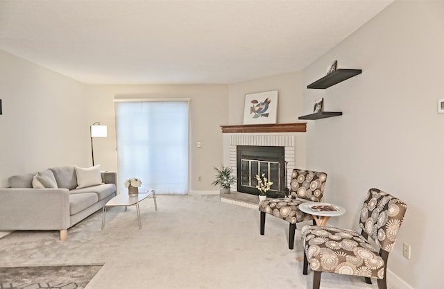 carpeted living room with baseboards and a brick fireplace