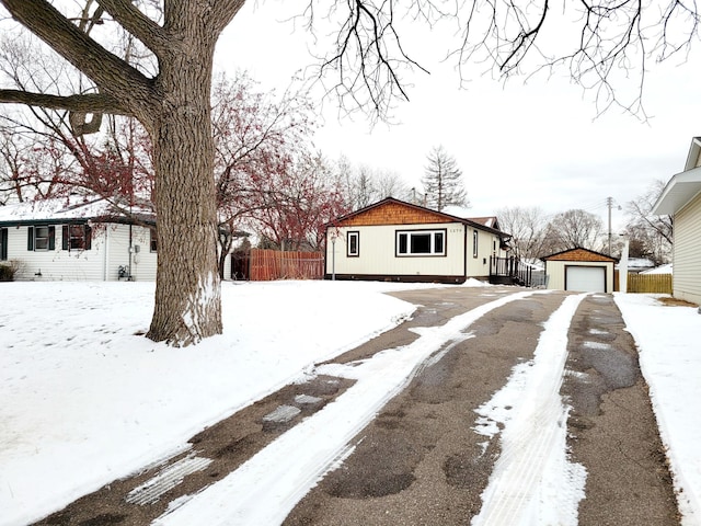 view of front of property featuring an outbuilding and a garage