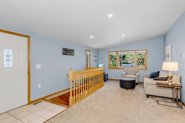 living room with lofted ceiling and light colored carpet