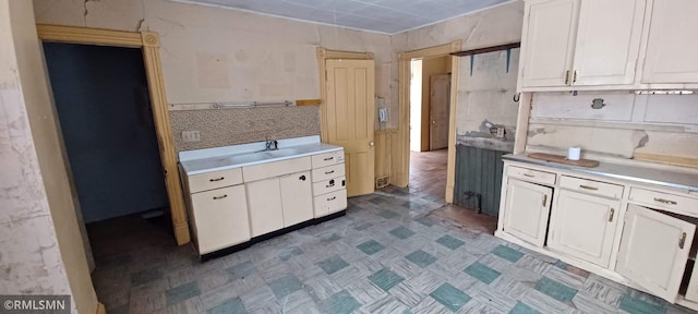 kitchen featuring white cabinetry