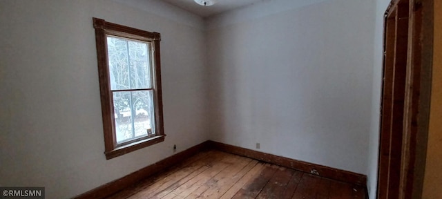 spare room featuring hardwood / wood-style flooring