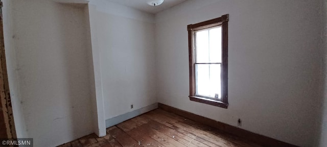 empty room featuring hardwood / wood-style floors and a wealth of natural light