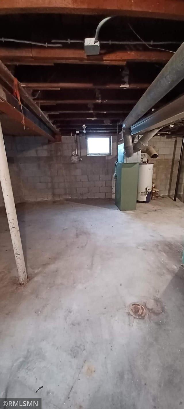 basement with heating unit and gas water heater